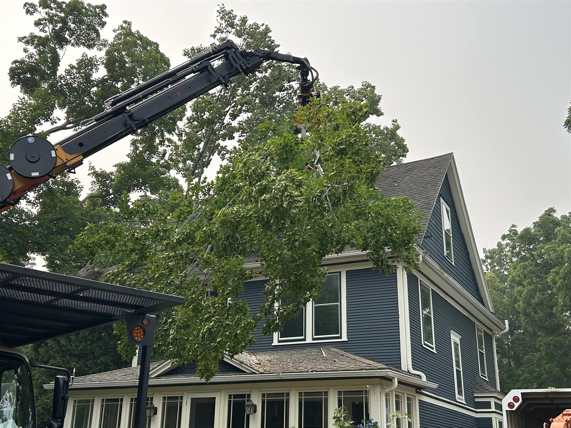 Madison Tree Cutting Service - Precision with Altec Knuckle Boom.