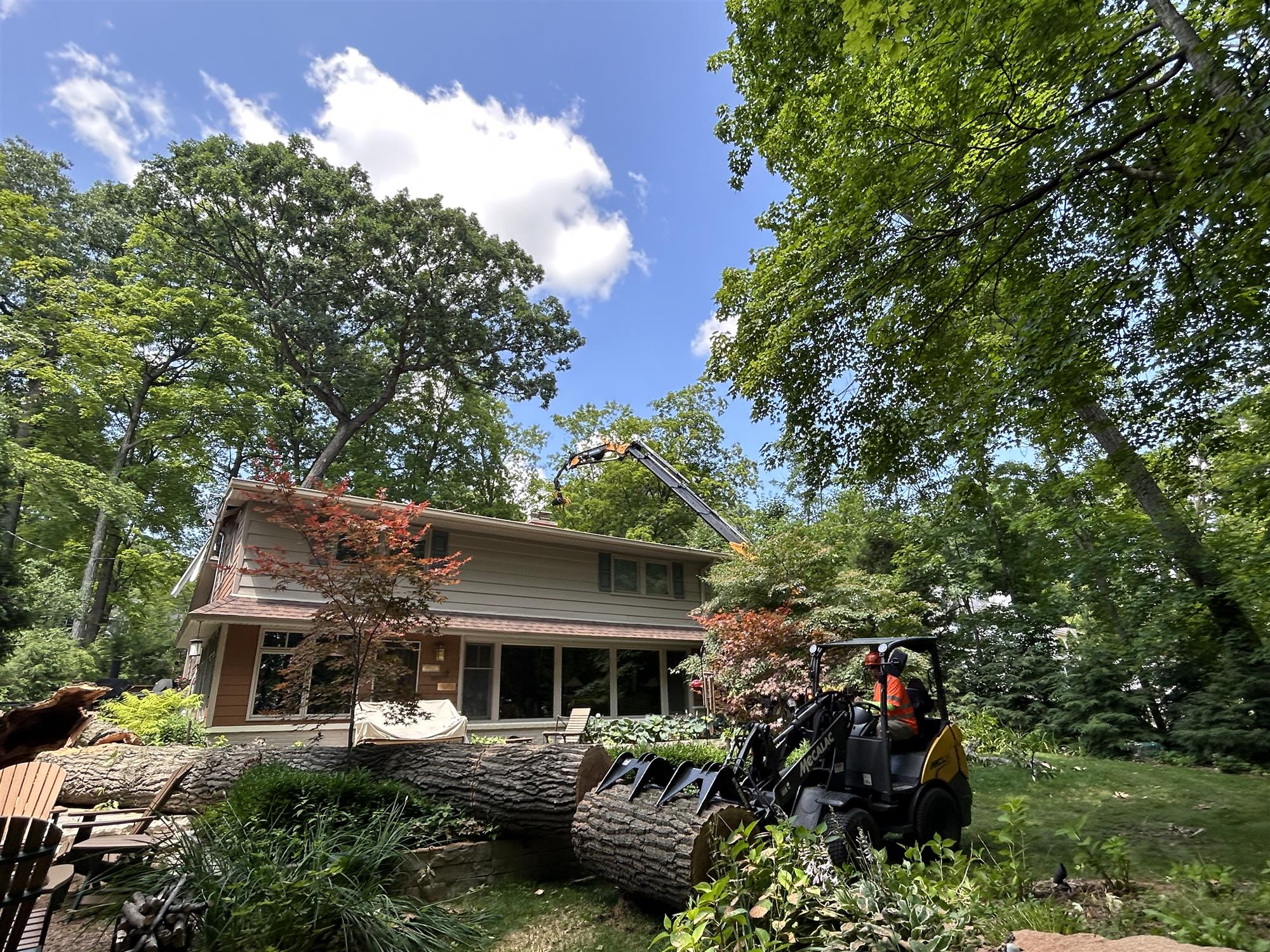 Madison Tree Cutting Service - Precision with Altec Knuckle Boom.